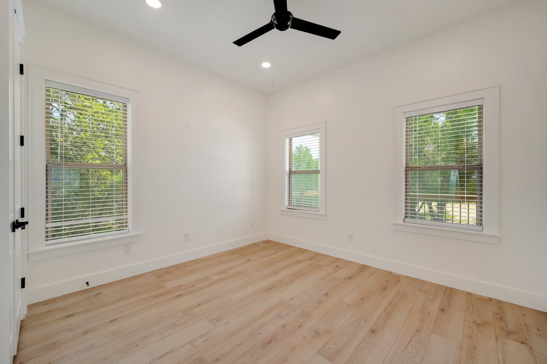 2 Cherokee Trail Wimberley, TX 78676 - Photo 17 of 26 a view of an empty room with wooden floor and a window