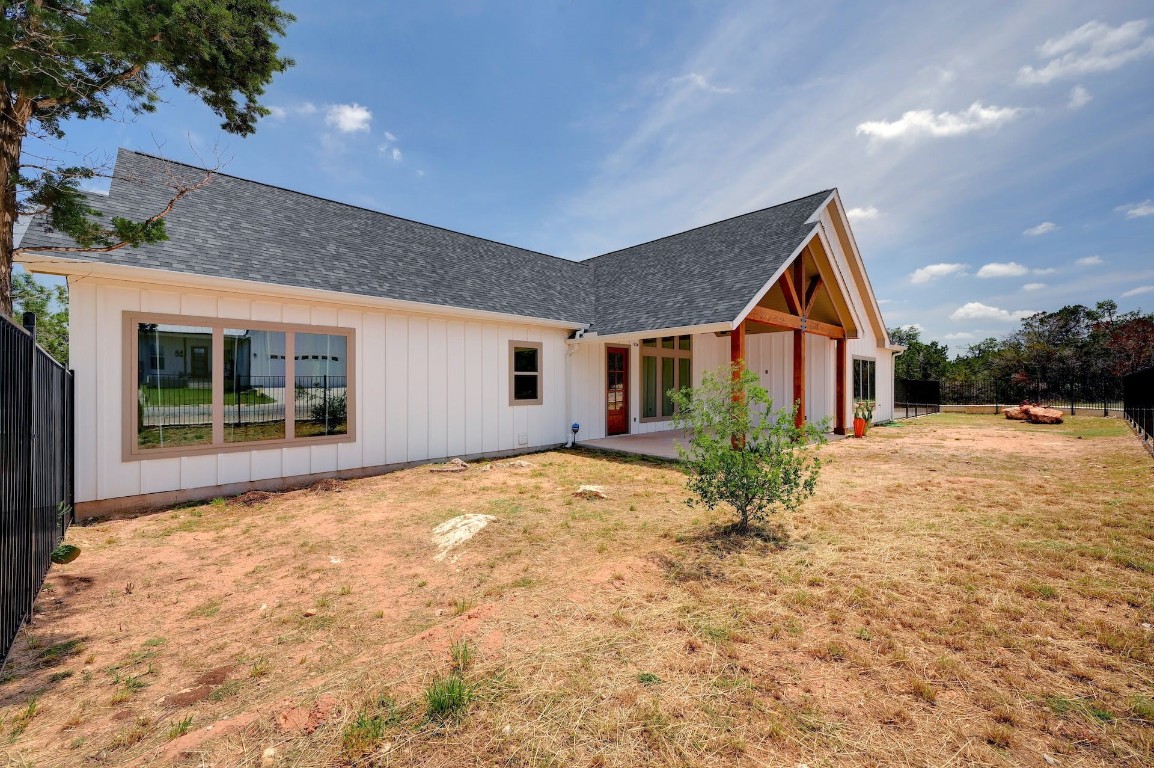 2 Cherokee Trail Wimberley, TX 78676 - Photo 21 of 26 a view of a house with a yard and potted plants