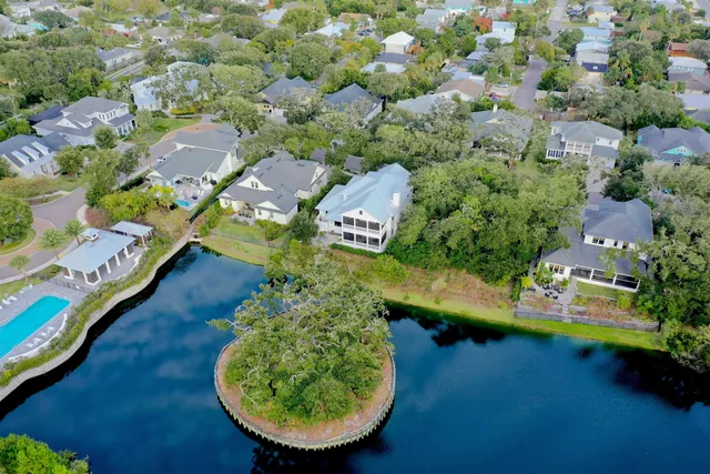 an aerial view of a house with a swimming pool yard and outdoor seating