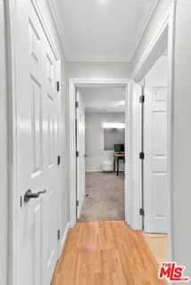 a view of a bedroom from a hallway