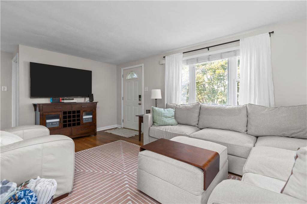 56 Elizabeth Street Pittsburgh, PA 15209 - Photo 11 of 30 a living room with furniture and a flat screen tv