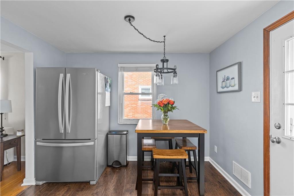 56 Elizabeth Street Pittsburgh, PA 15209 - Photo 14 of 30 a kitchen with refrigerator and wooden floor