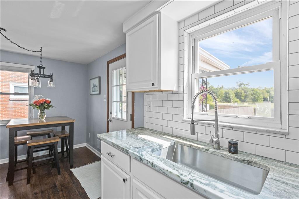 56 Elizabeth Street Pittsburgh, PA 15209 - Photo 15 of 30 a kitchen with granite countertop a sink and a window