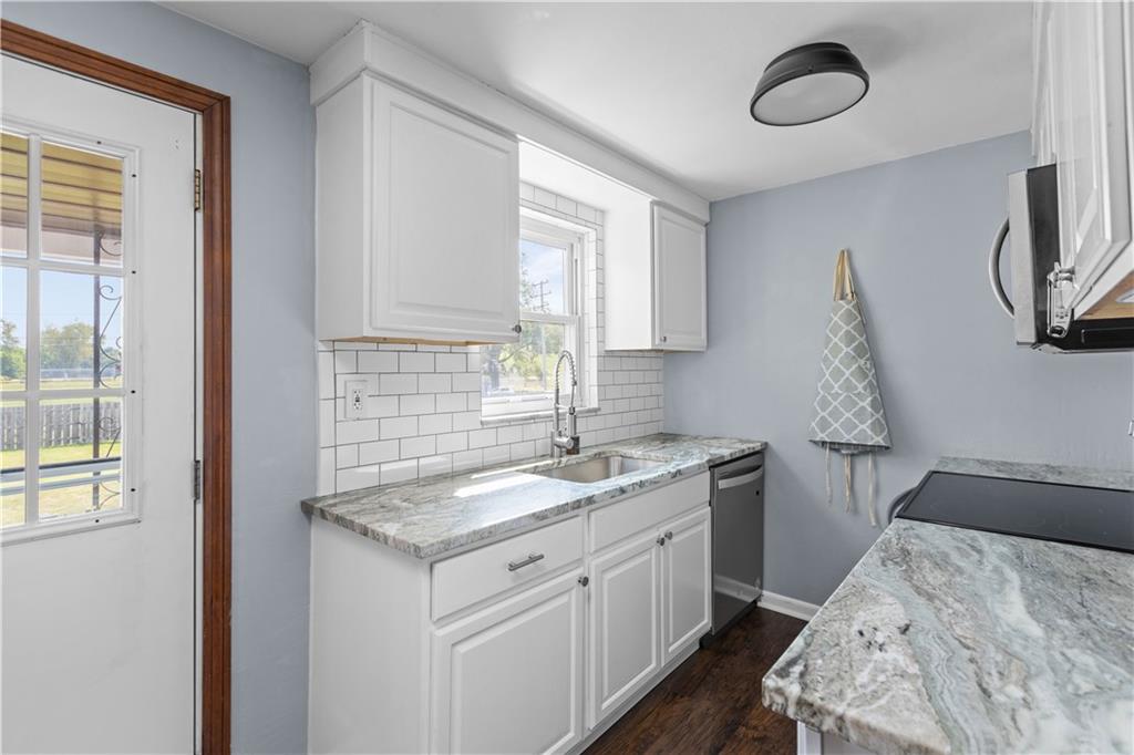 56 Elizabeth Street Pittsburgh, PA 15209 - Photo 16 of 30 a en suite bathroom with a granite countertop sink and a window