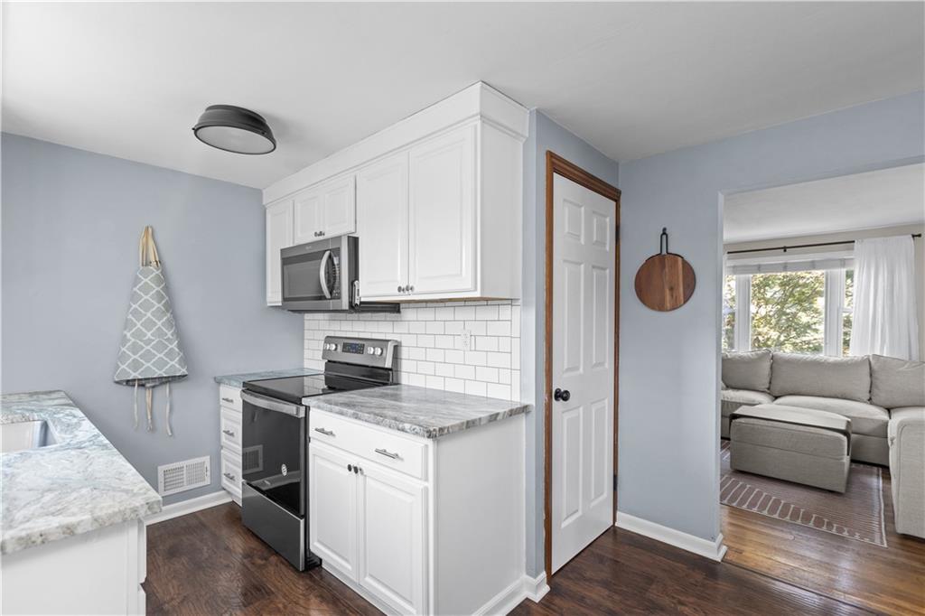 56 Elizabeth Street Pittsburgh, PA 15209 - Photo 17 of 30 a kitchen with stainless steel appliances granite countertop a refrigerator sink and stove top oven