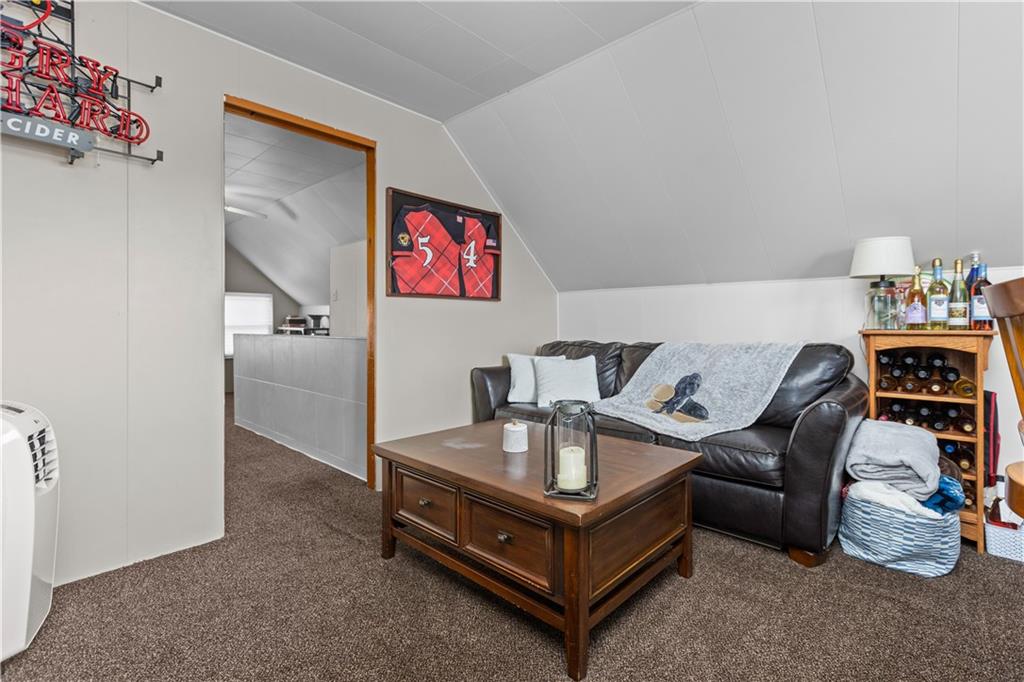 56 Elizabeth Street Pittsburgh, PA 15209 - Photo 26 of 30 a living room with furniture and a couch