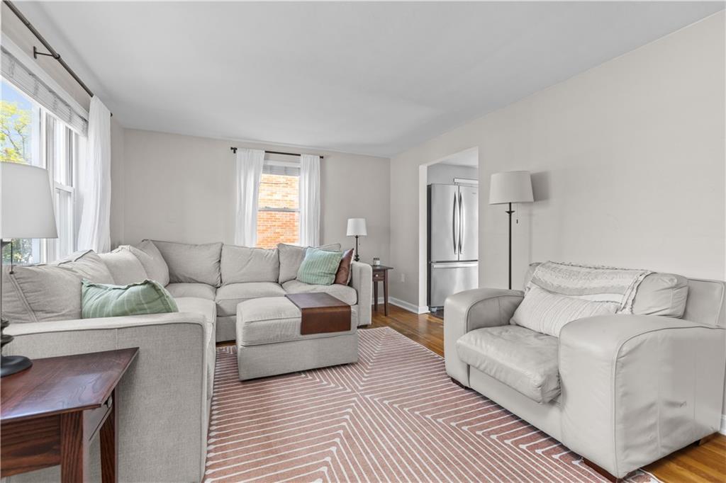 56 Elizabeth Street Pittsburgh, PA 15209 - Photo 9 of 30 a living room with furniture and a couch