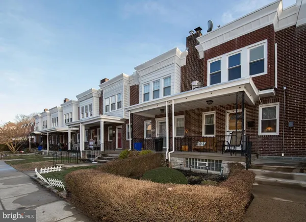a view of a brick building with many windows