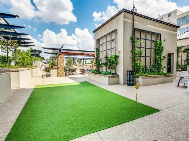 a very nice looking room with many windows and furniture