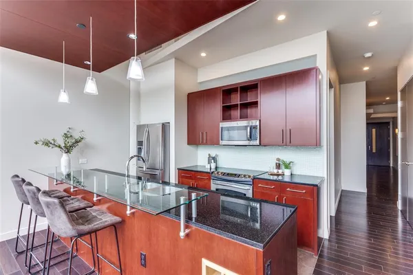 a living room with furniture a couch and a window