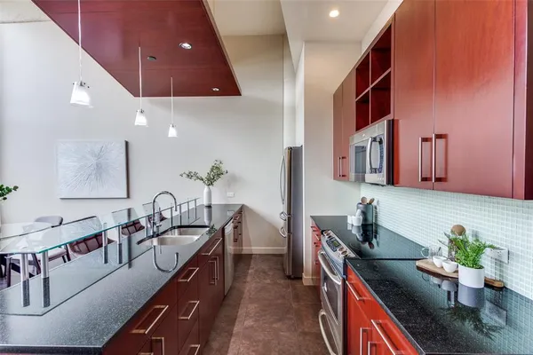 a bedroom with a bed and a night stand