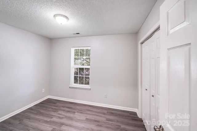 a bathroom with a tub toilet and shower