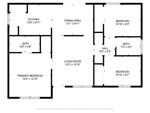 an empty room with a window and a ceiling fan