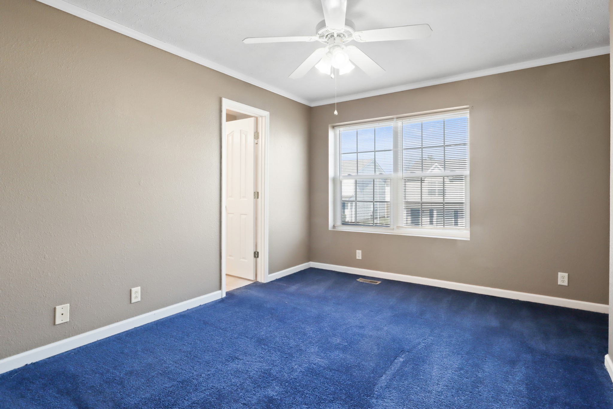 245 Shoshone Place Murfreesboro, TN 37128 - Photo 14 of 23 an empty room with chandelier fan and windows