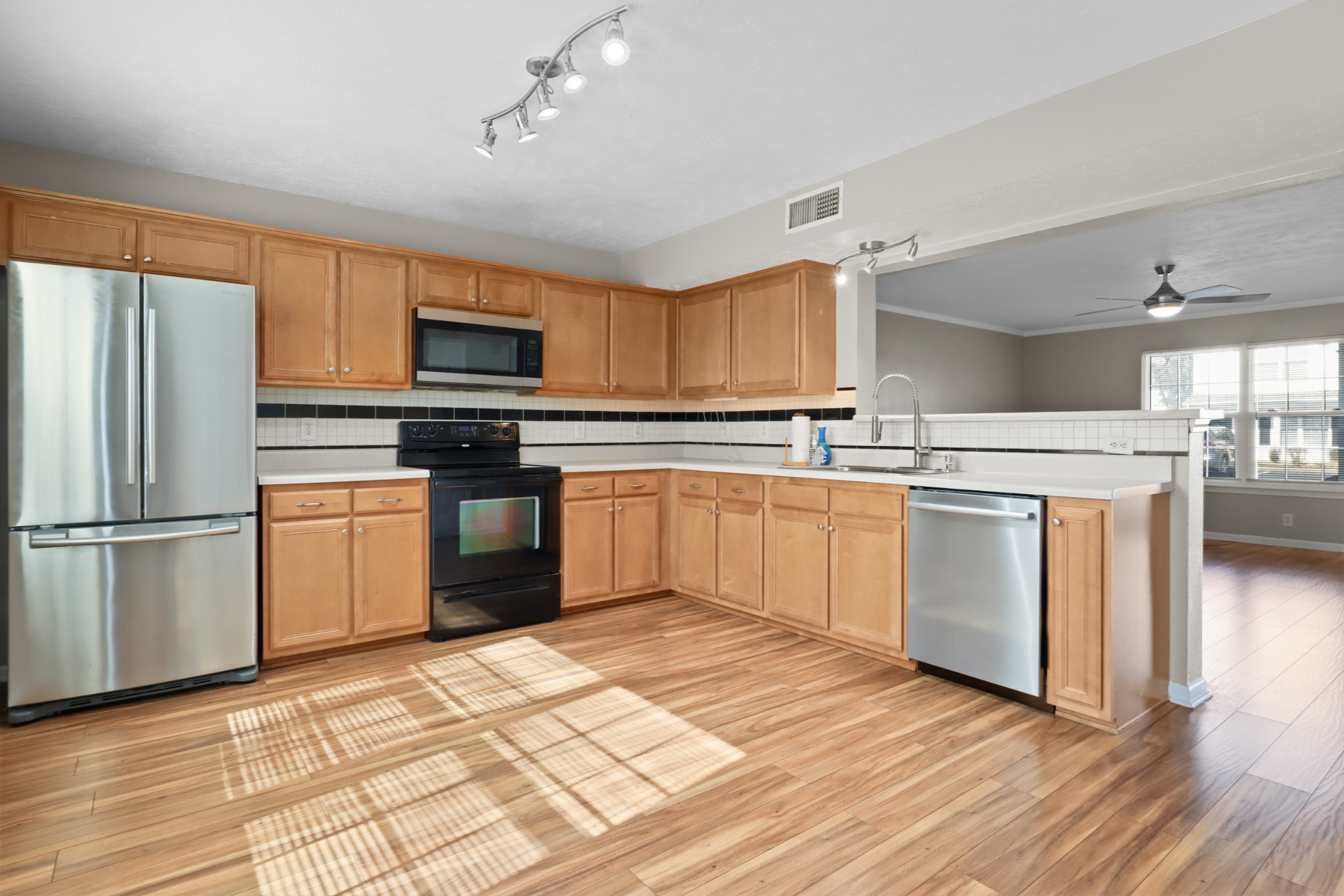 245 Shoshone Place Murfreesboro, TN 37128 - Photo 6 of 23 a kitchen with white cabinets and white appliances