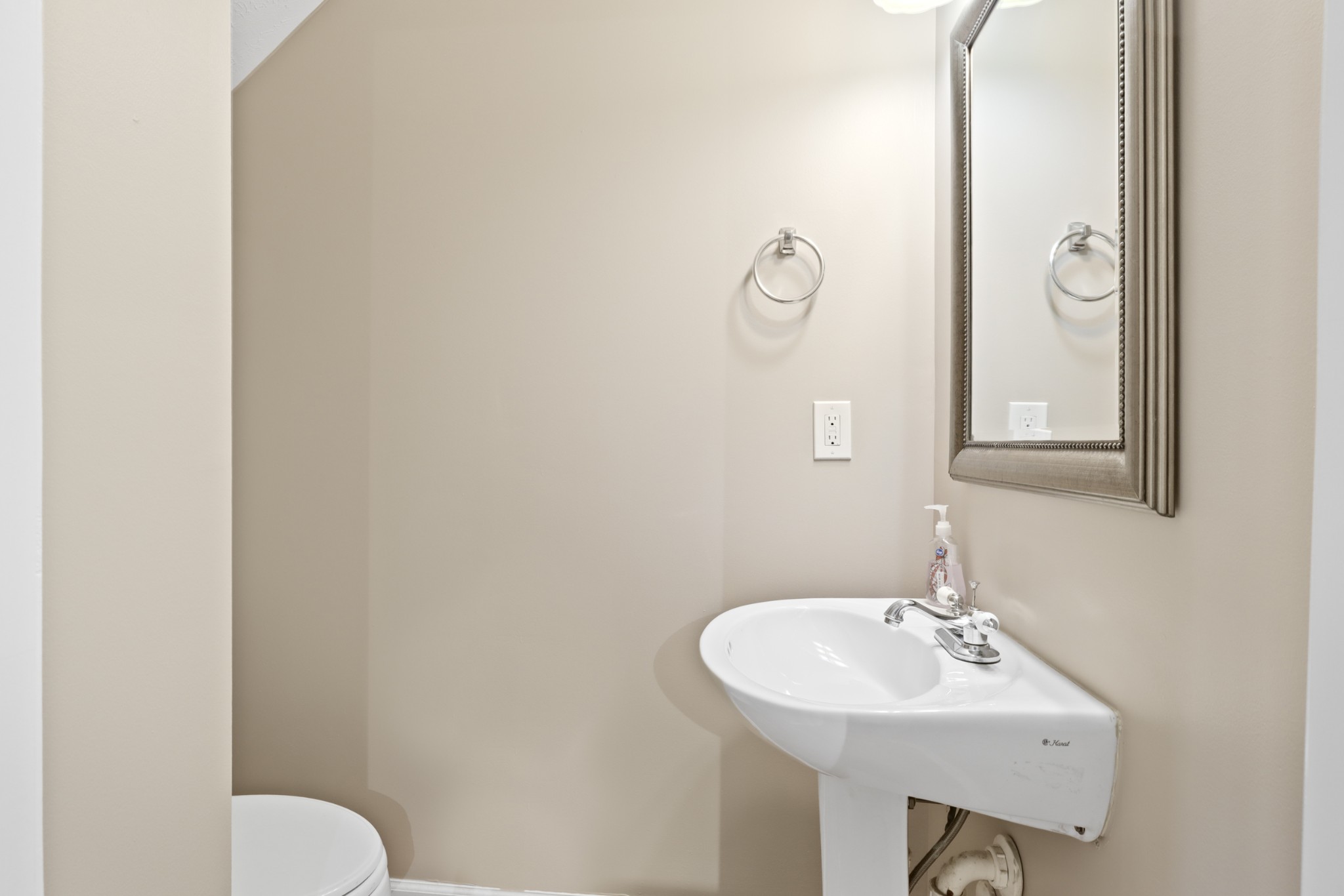 245 Shoshone Place Murfreesboro, TN 37128 - Photo 7 of 23 a bathroom with a toilet sink and mirror