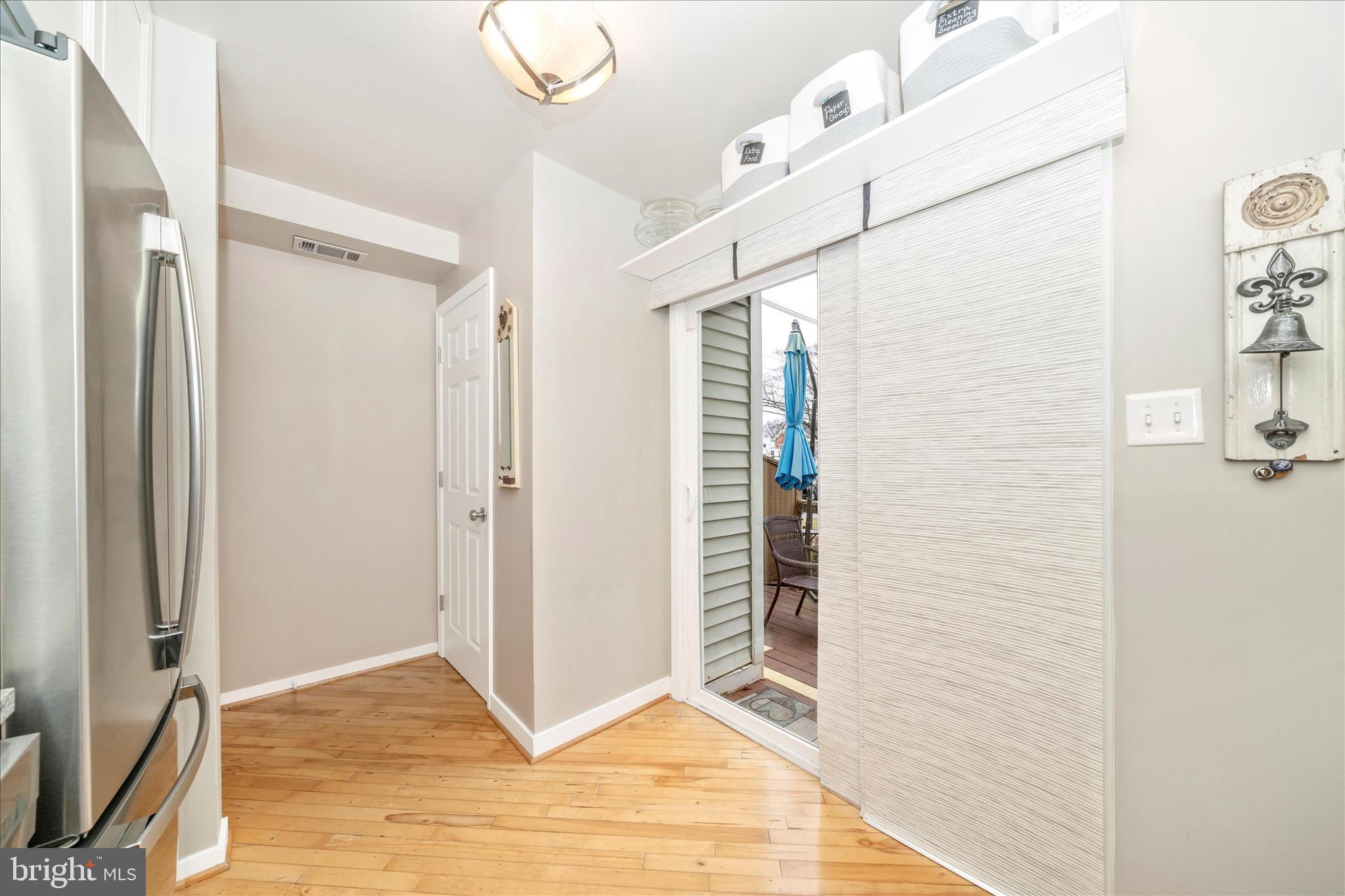 103 East 8th Street, Unit 103C Frederick, MD 21701 - Photo 11 of 34 a view of empty room with wooden floor and fan