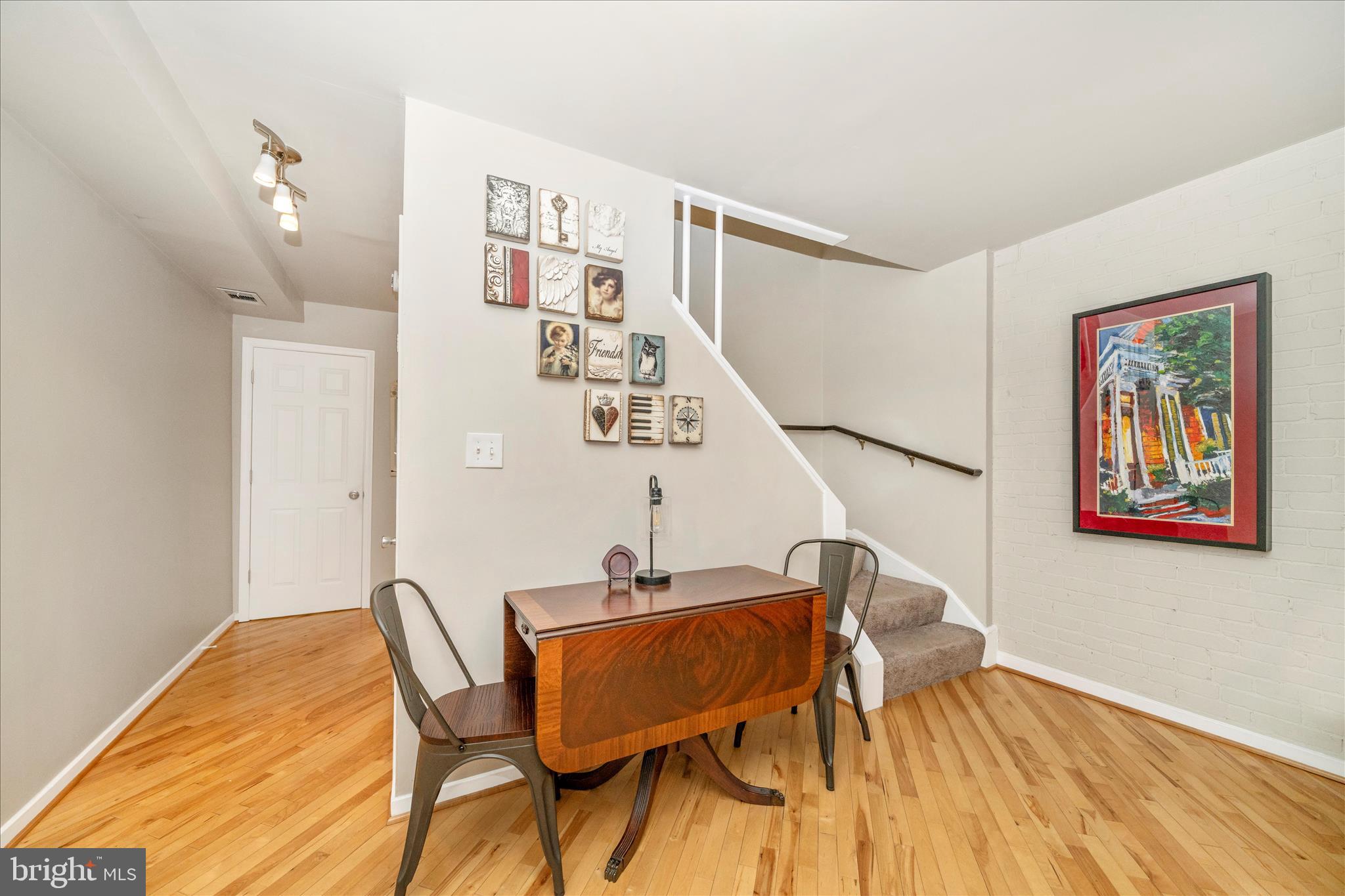 103 East 8th Street, Unit 103C Frederick, MD 21701 - Photo 13 of 34 a view of a room with furniture and wooden floor