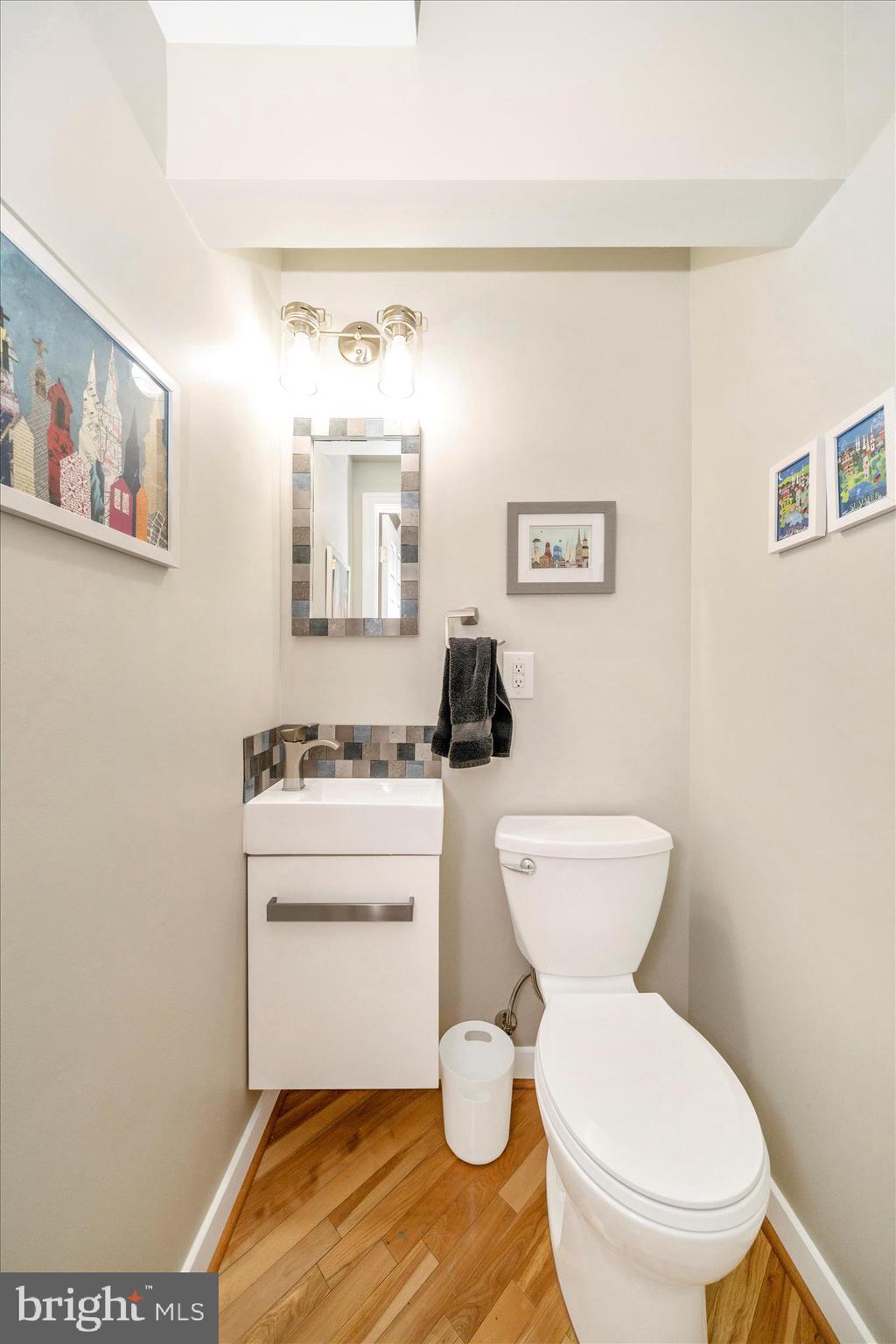 103 East 8th Street, Unit 103C Frederick, MD 21701 - Photo 16 of 34 a bathroom with a toilet a sink and a mirror