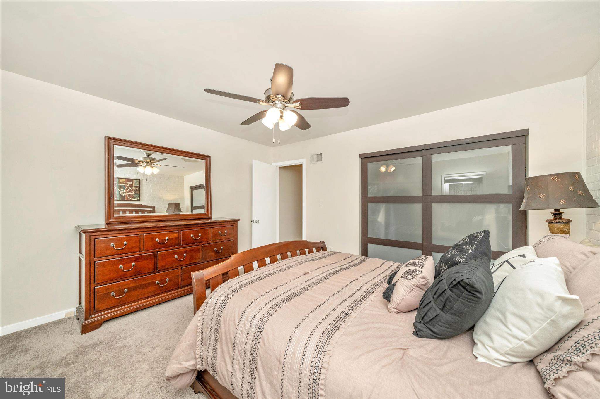 103 East 8th Street, Unit 103C Frederick, MD 21701 - Photo 19 of 34 a bedroom with a bed and wooden floor