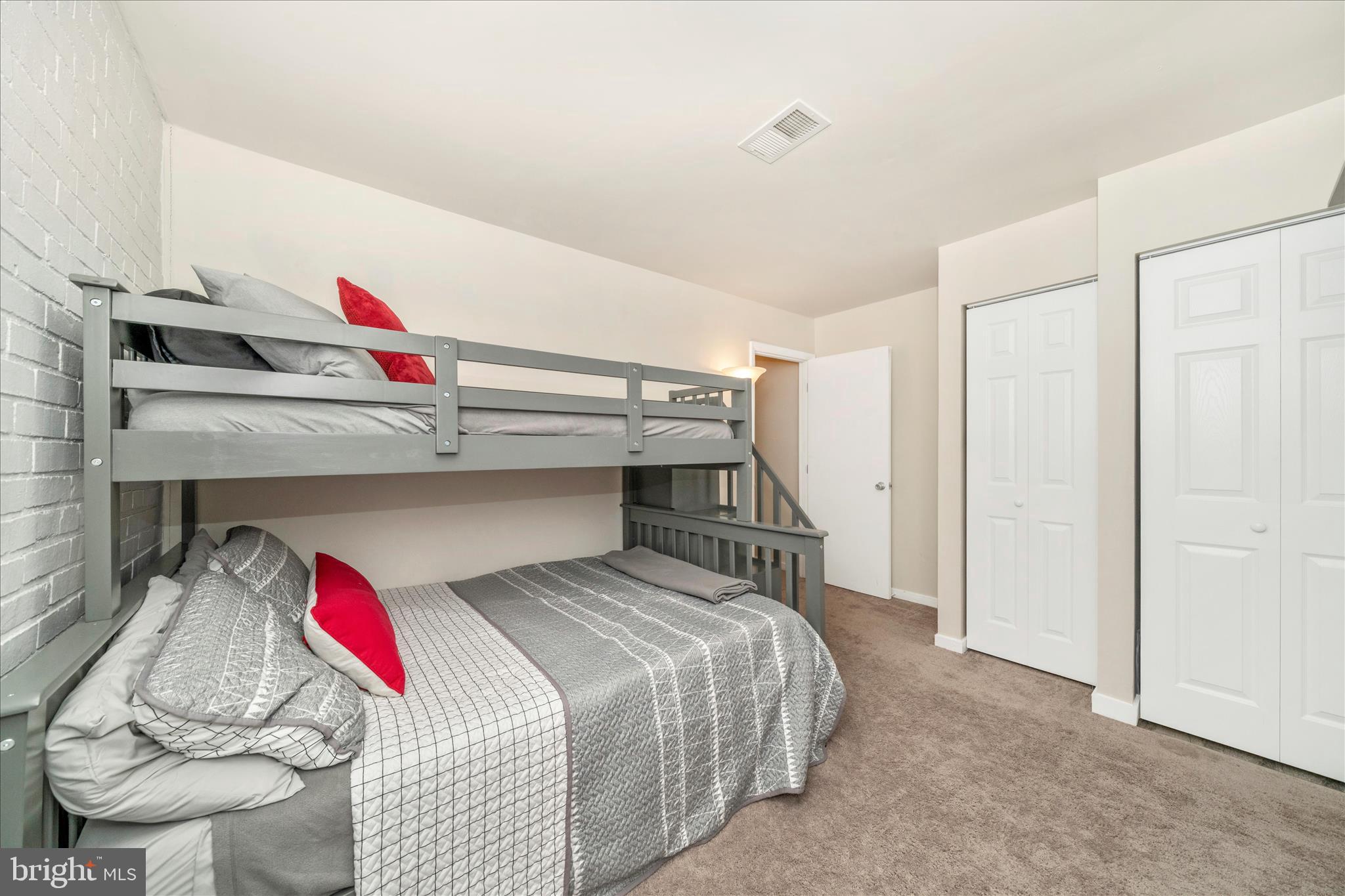 103 East 8th Street, Unit 103C Frederick, MD 21701 - Photo 23 of 34 a bedroom with a bed and cabinets
