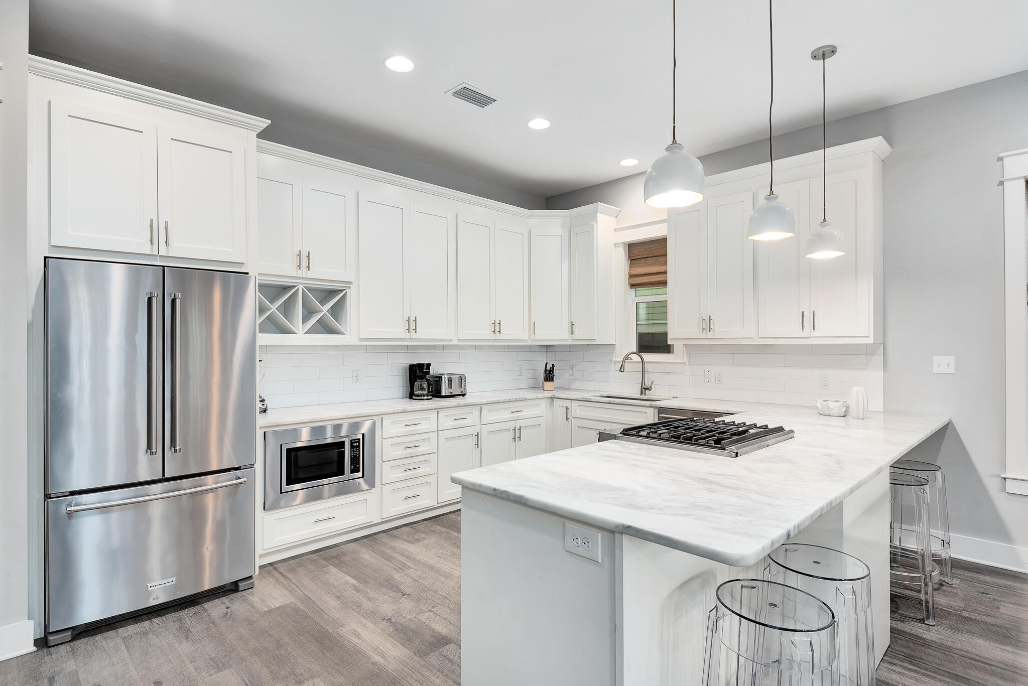 110 Surfer Lane Inlet Beach, FL 32461 - Photo 12 of 55 a kitchen with kitchen island a white cabinets and refrigerator