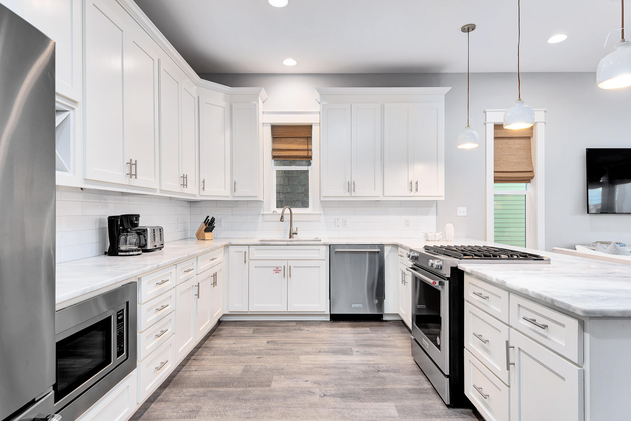 110 Surfer Lane Inlet Beach, FL 32461 - Photo 13 of 55 a kitchen with granite countertop white cabinets and white appliances