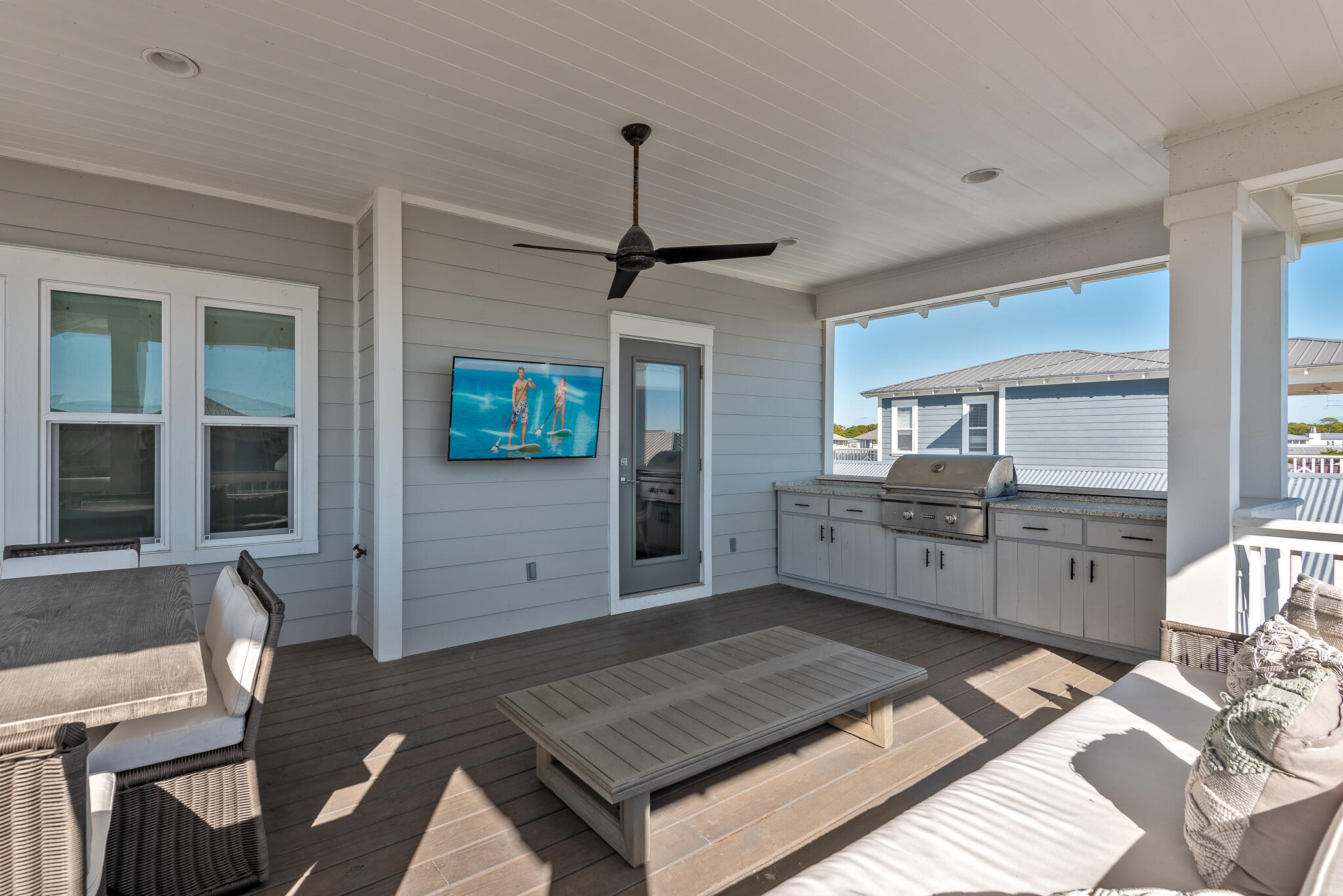 110 Surfer Lane Inlet Beach, FL 32461 - Photo 25 of 55 a kitchen with stainless steel appliances granite countertop a sink dishwasher a stove a refrigerator a dining table and chairs with wooden floor