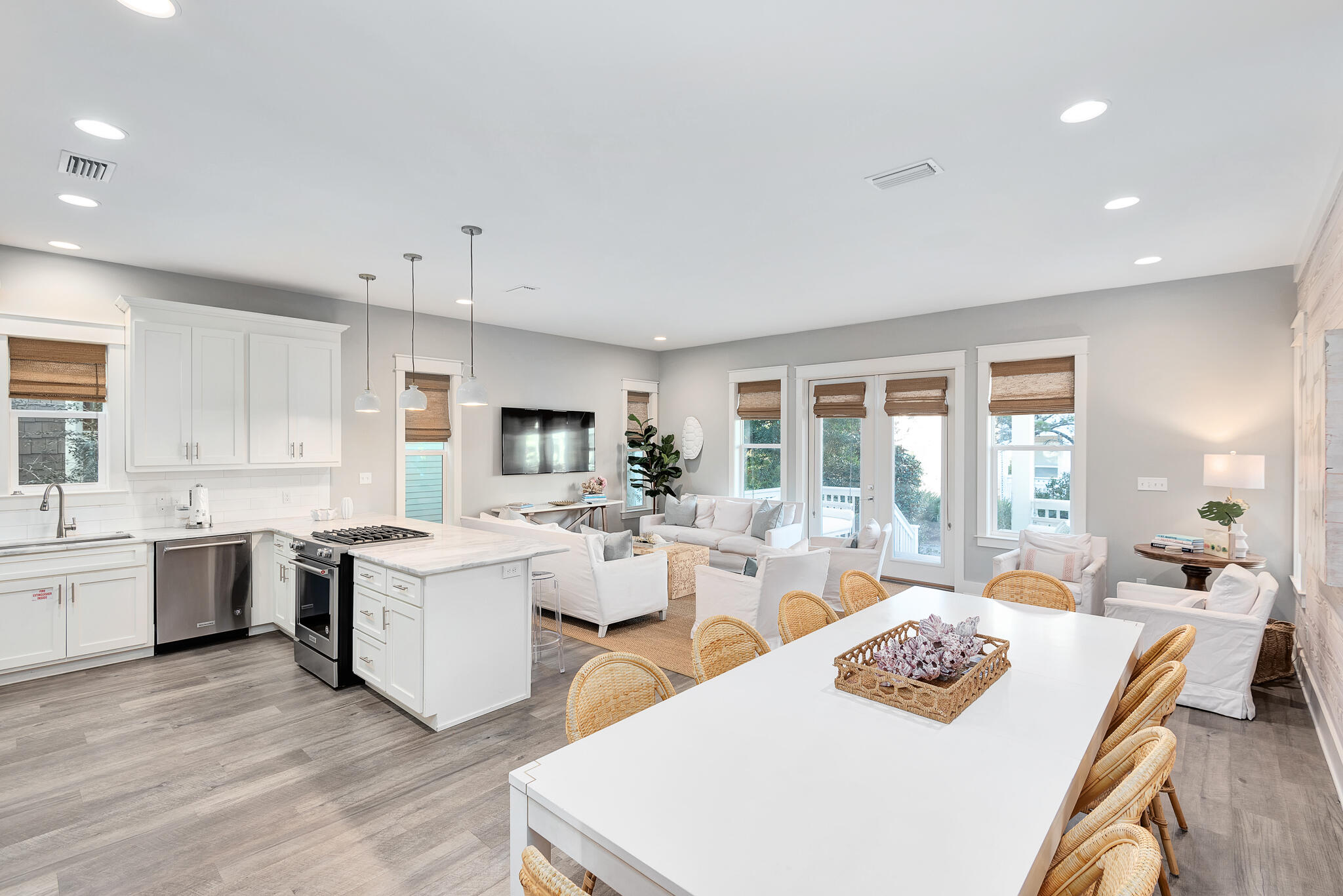 110 Surfer Lane Inlet Beach, FL 32461 - Photo 3 of 55 a large white kitchen with sink stove and white cabinets with wooden floor