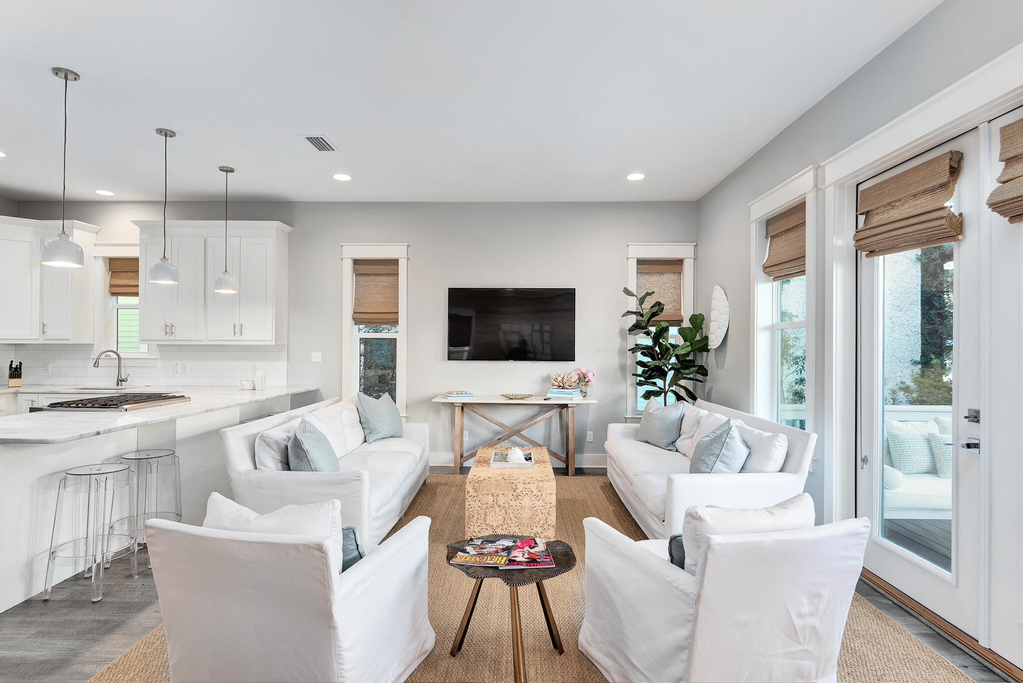 110 Surfer Lane Inlet Beach, FL 32461 - Photo 6 of 55 a living room with furniture a flat screen tv and a chandelier