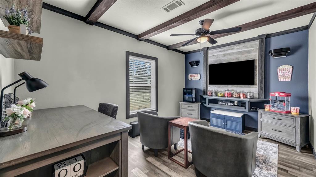 623 County Road 123 Comanche, TX 76442 - Photo 15 of 26 a living room with furniture and a flat screen tv