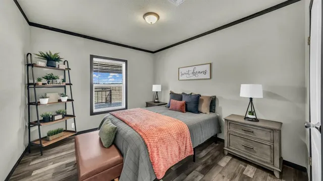 a bedroom with a bed and a window