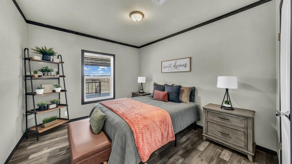 623 County Road 123 Comanche, TX 76442 - Photo 15 of 20 a bedroom with a bed and a window