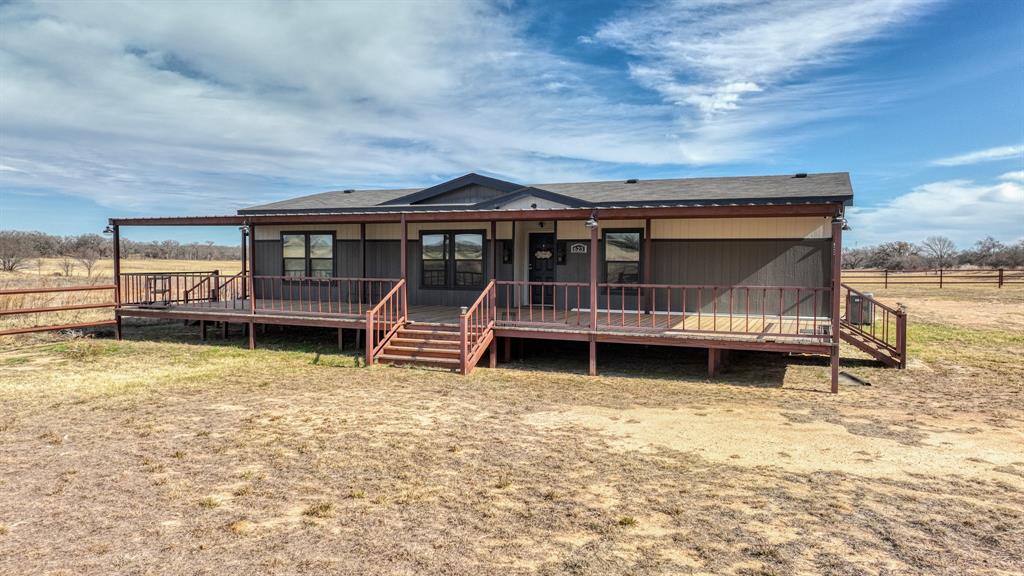 623 County Road 123 Comanche, TX 76442 - Photo 18 of 26 a view of a house with a yard