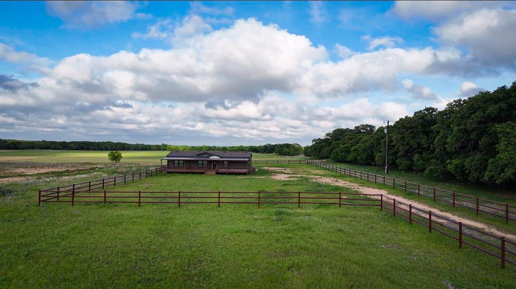 623 County Road 123 Comanche, TX 76442 - Photo 2 of 26 a view of a golf course with a lake
