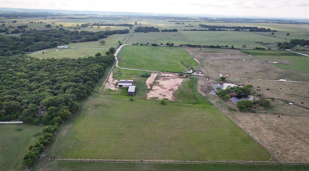 623 County Road 123 Comanche, TX 76442 - Photo 21 of 26 an aerial view of a house with a yard