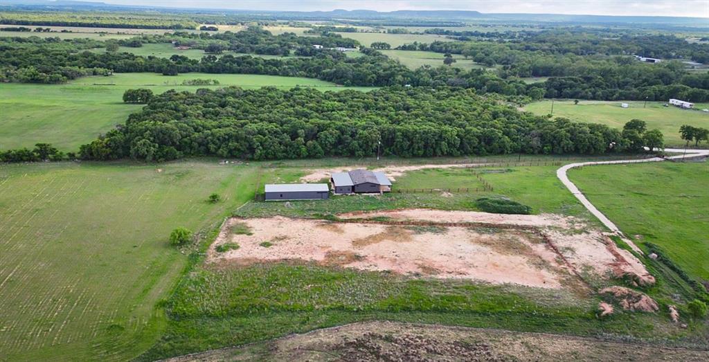 623 County Road 123 Comanche, TX 76442 - Photo 26 of 26 an aerial view of a golf course with a lake view