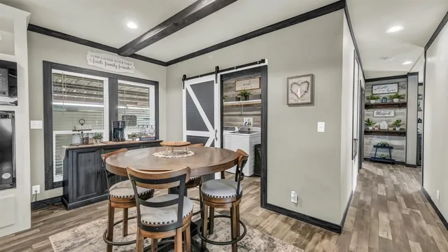 a dining room with furniture and window