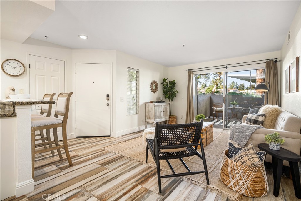 2800 Keller Drive, Unit 252 Tustin, CA 92782 - Photo 15 of 44 a living room with furniture and a large window