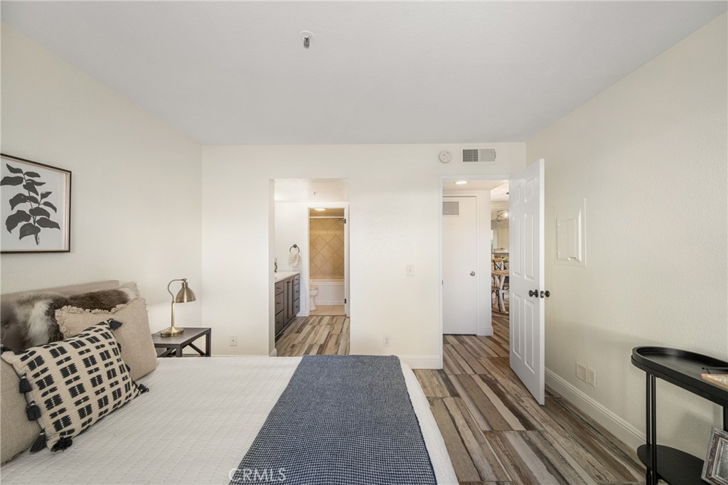 2800 Keller Drive, Unit 252 Tustin, CA 92782 - Photo 20 of 44 a bedroom with a bed and a couch