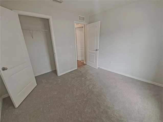 an empty room with closet
