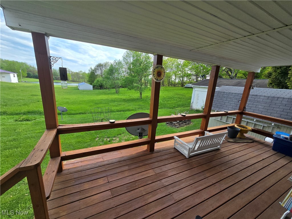 26566 Tri County Fairground Road Freeport, OH 43973 - Photo 18 of 21 Wooden deck with a lawn