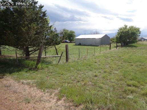 10970 Garrett Road Peyton, CO 80831 - Photo 47 of 50 a backyard of a house with lots of green space