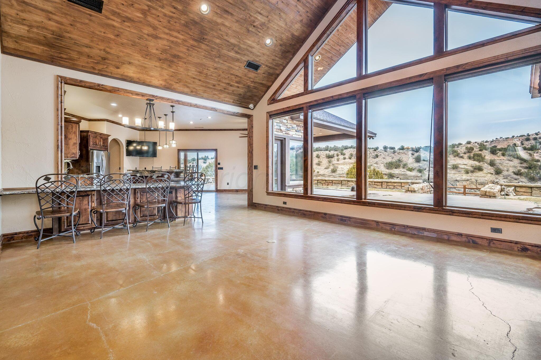 8150 Little Fox Trail Amarillo, TX 79118 - Photo 13 of 69 a large room with pool table and chairs