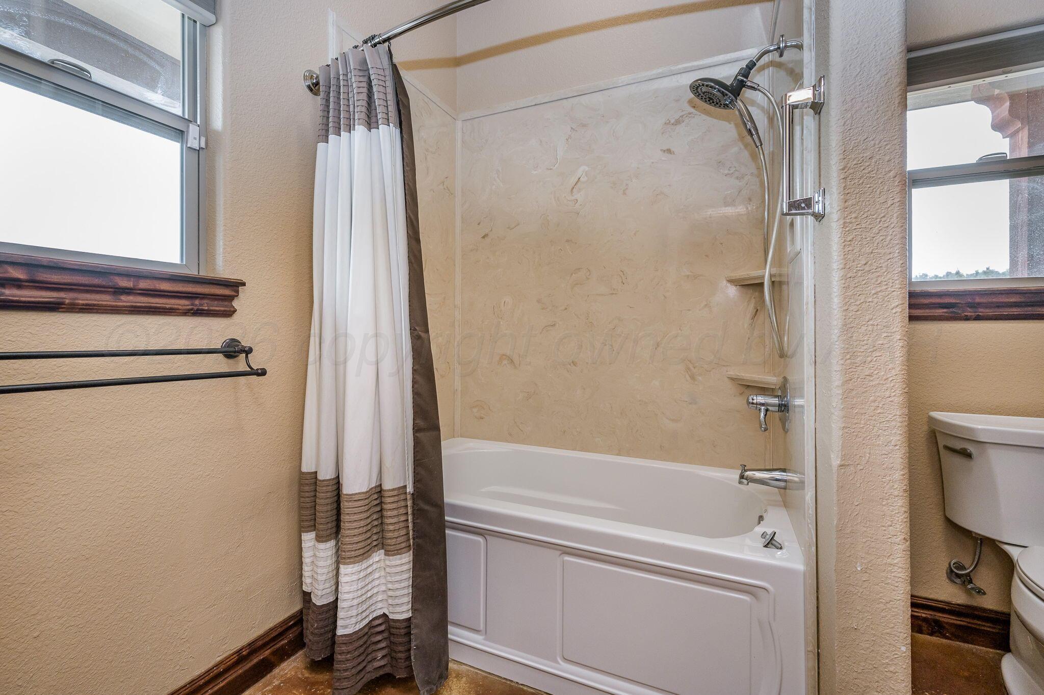 8150 Little Fox Trail Amarillo, TX 79118 - Photo 32 of 69 a bathroom with a bathtub and a shower