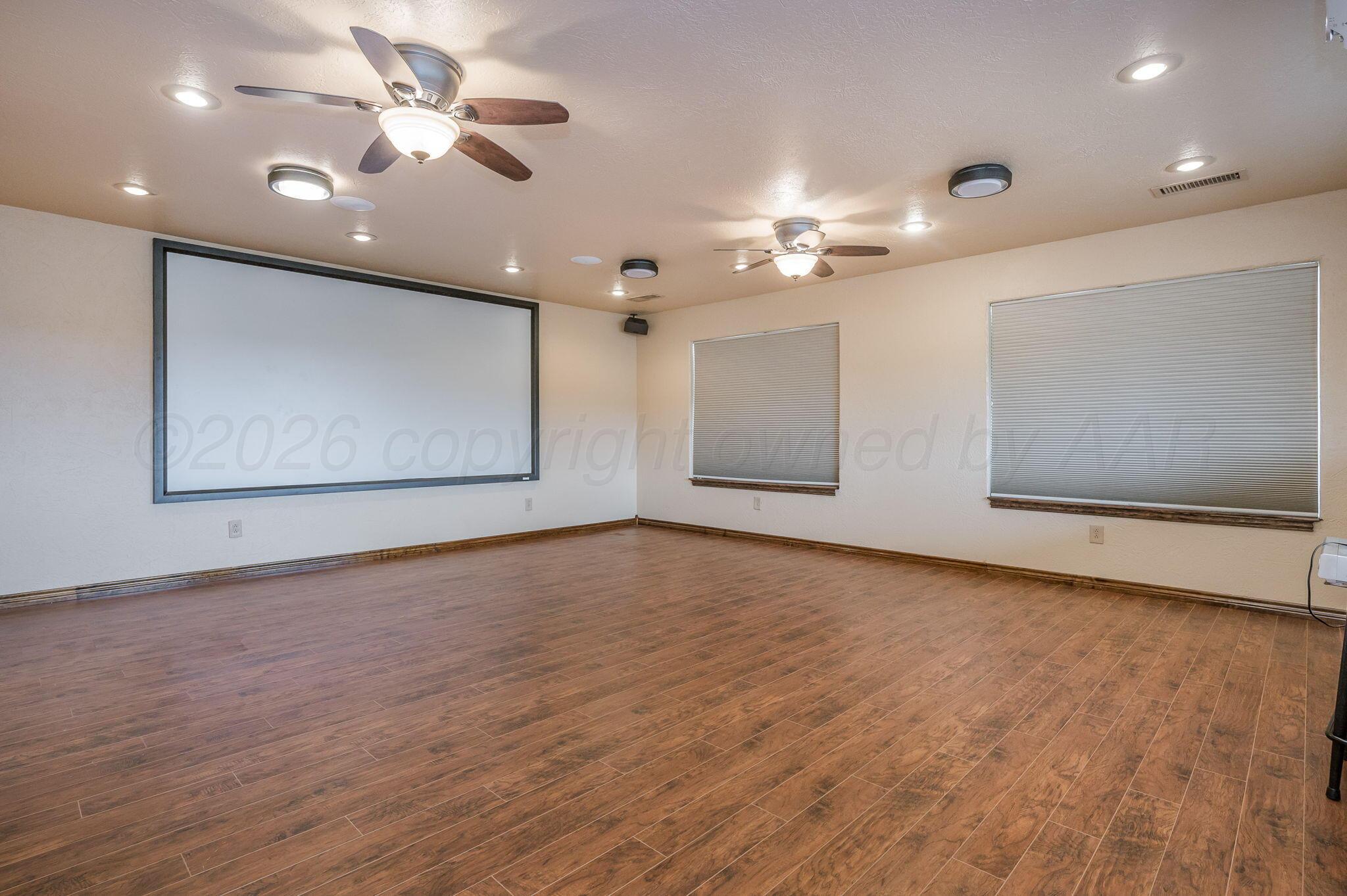8150 Little Fox Trail Amarillo, TX 79118 - Photo 43 of 69 a view of an empty room with window and wooden floor