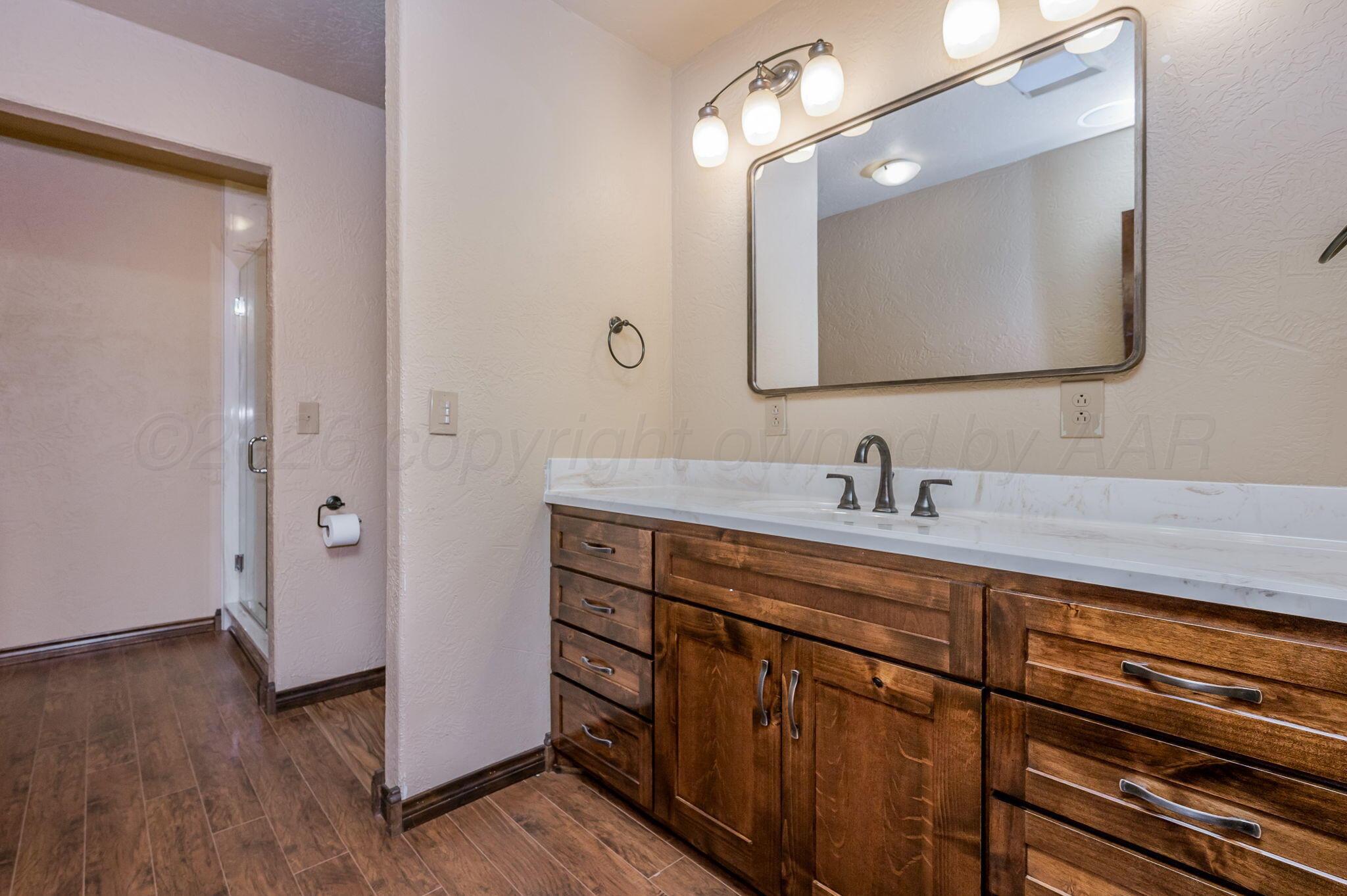 8150 Little Fox Trail Amarillo, TX 79118 - Photo 45 of 69 a bathroom with a double vanity sink and mirror