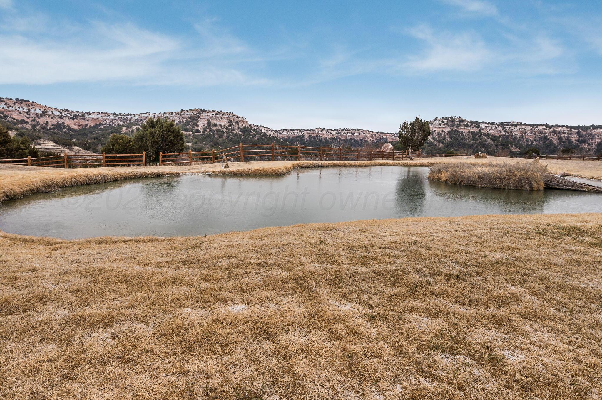 8150 Little Fox Trail Amarillo, TX 79118 - Photo 5 of 69 a view of a lake with houses in the back
