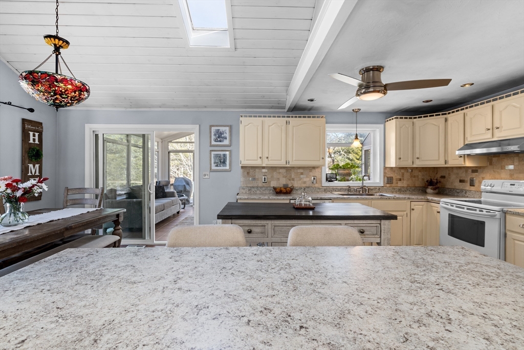 7 Carol Road Wareham, MA 02532 - Photo 12 of 42 a kitchen with stainless steel appliances granite countertop a stove sink and cabinets