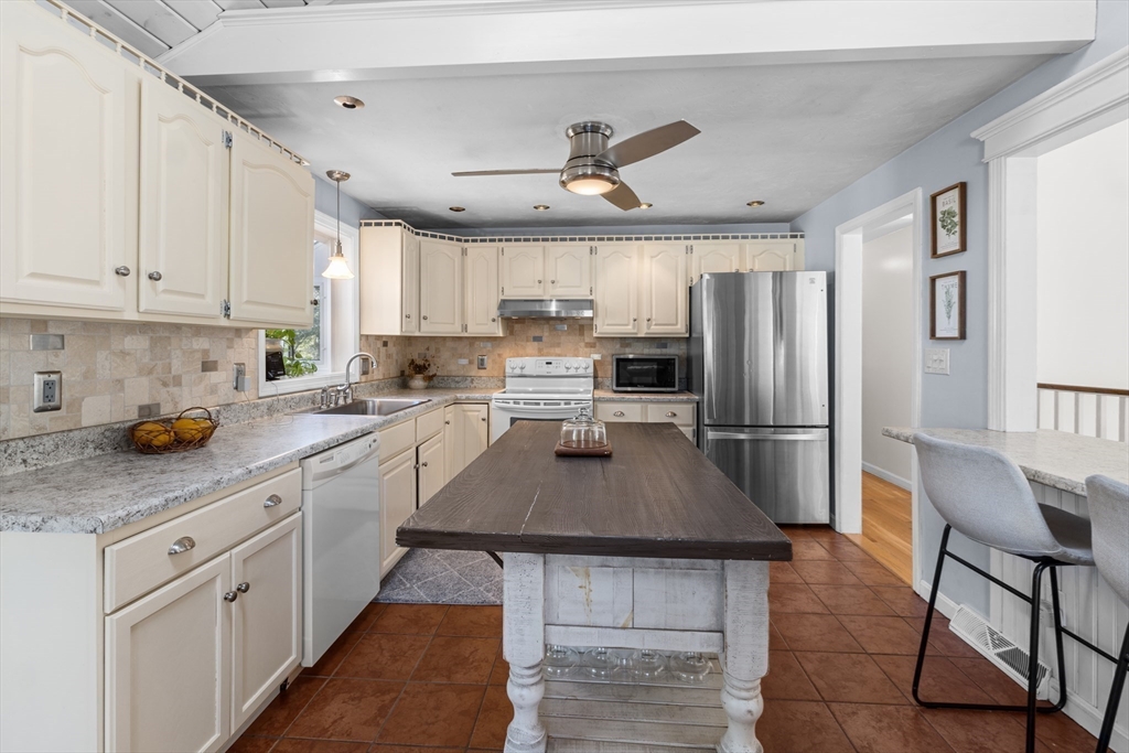 7 Carol Road Wareham, MA 02532 - Photo 14 of 42 a kitchen with refrigerator cabinets and a counter top space